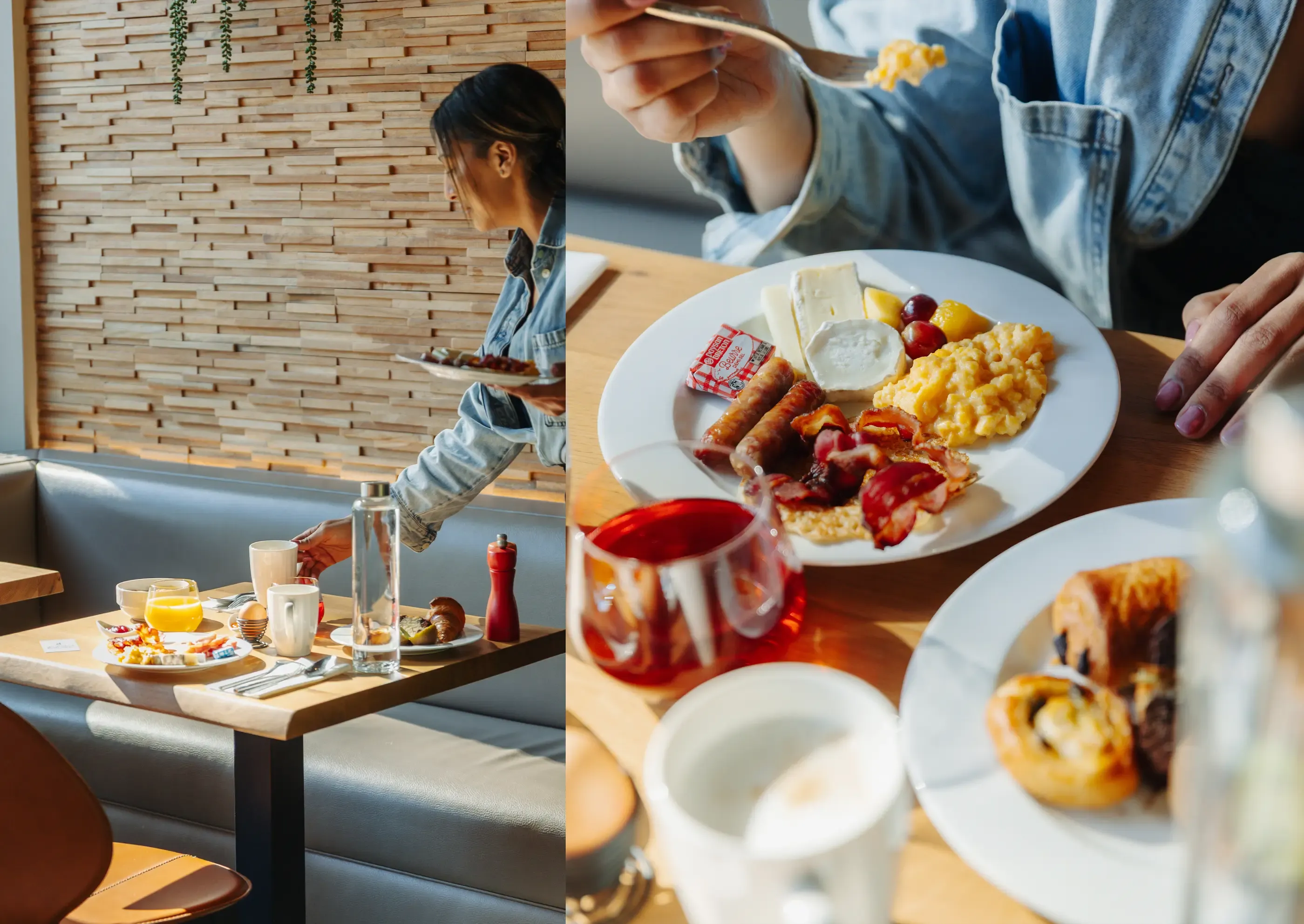 Personnes en train de manger un petit-déjeuner composé d'œufs, de saucisses, de pain et de fruits, dans un cadre intérieur avec des murs en briques et une table en bois